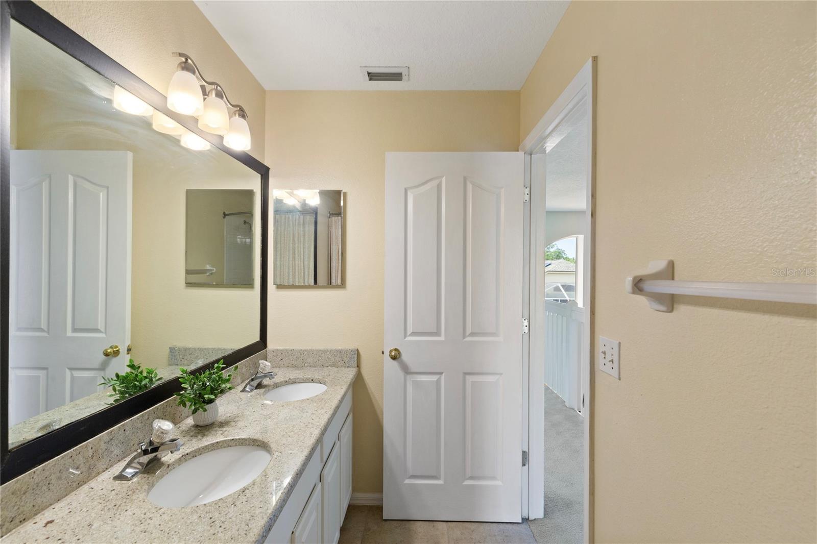 Medicine cabinet and granite countertops in bath