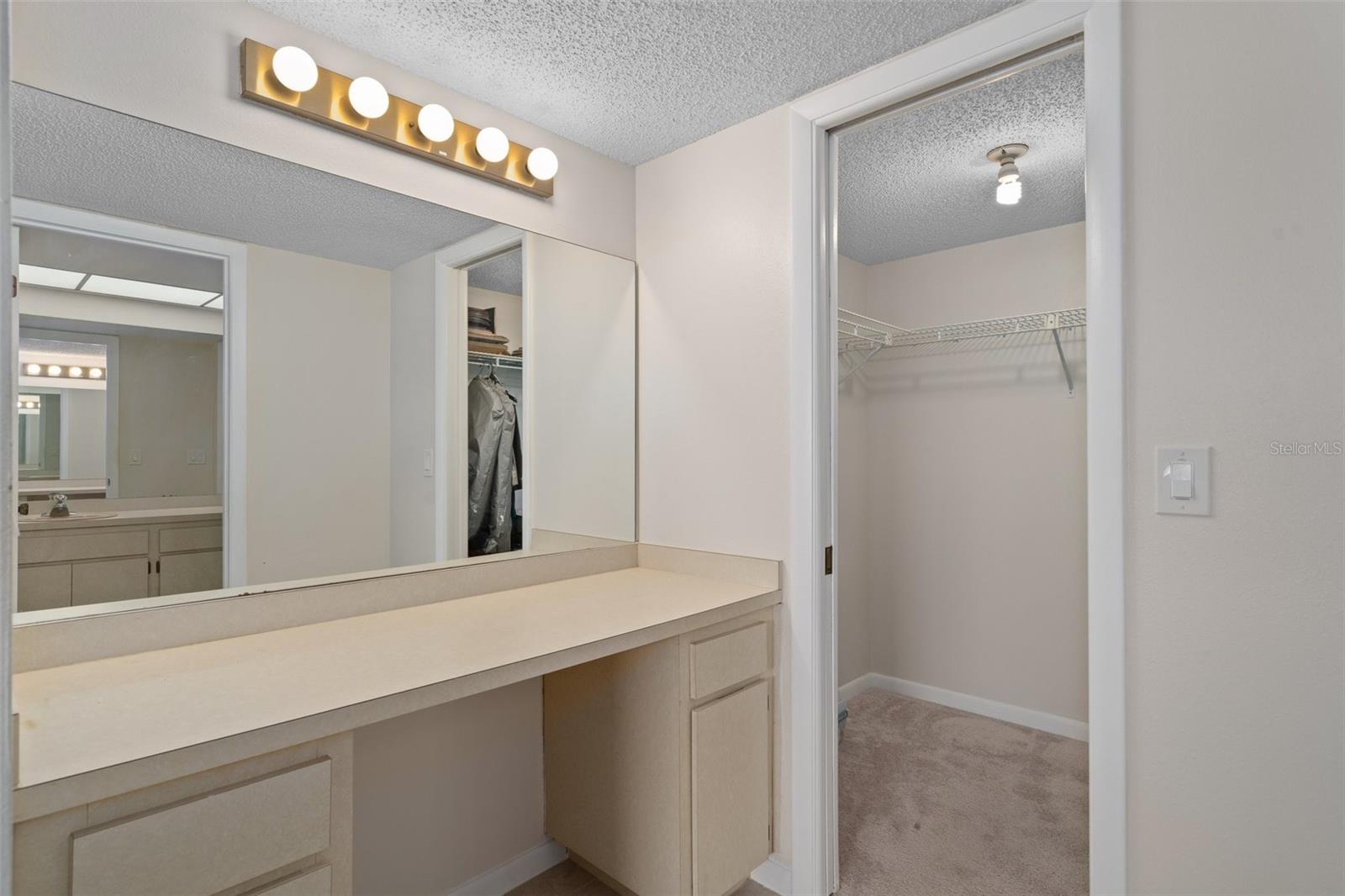 Vanity and Walk in Closet in Master