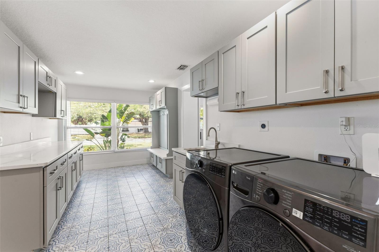 large laundry room with ample storage