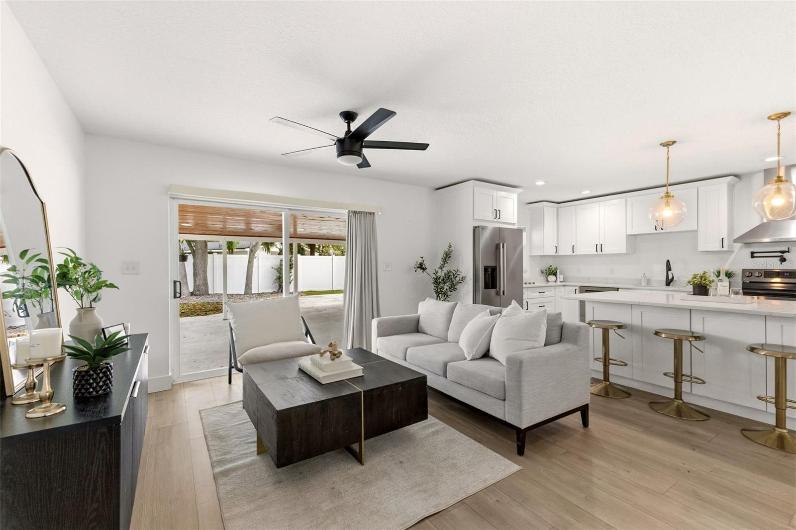 living room with sliders to backyard