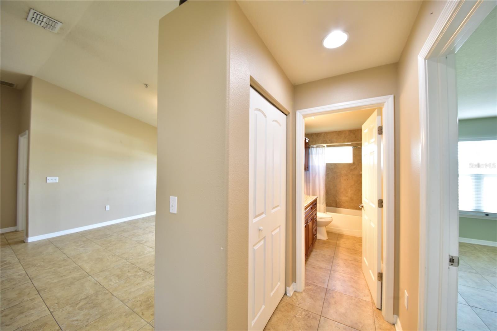 Hall Facing second bathroom, unstaged , furniture removed