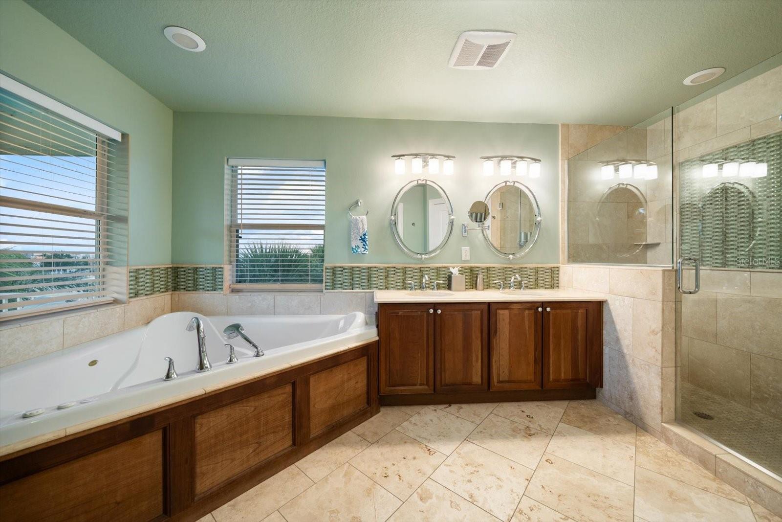 Beautifully appointed primary bathroom complete with modern features.
