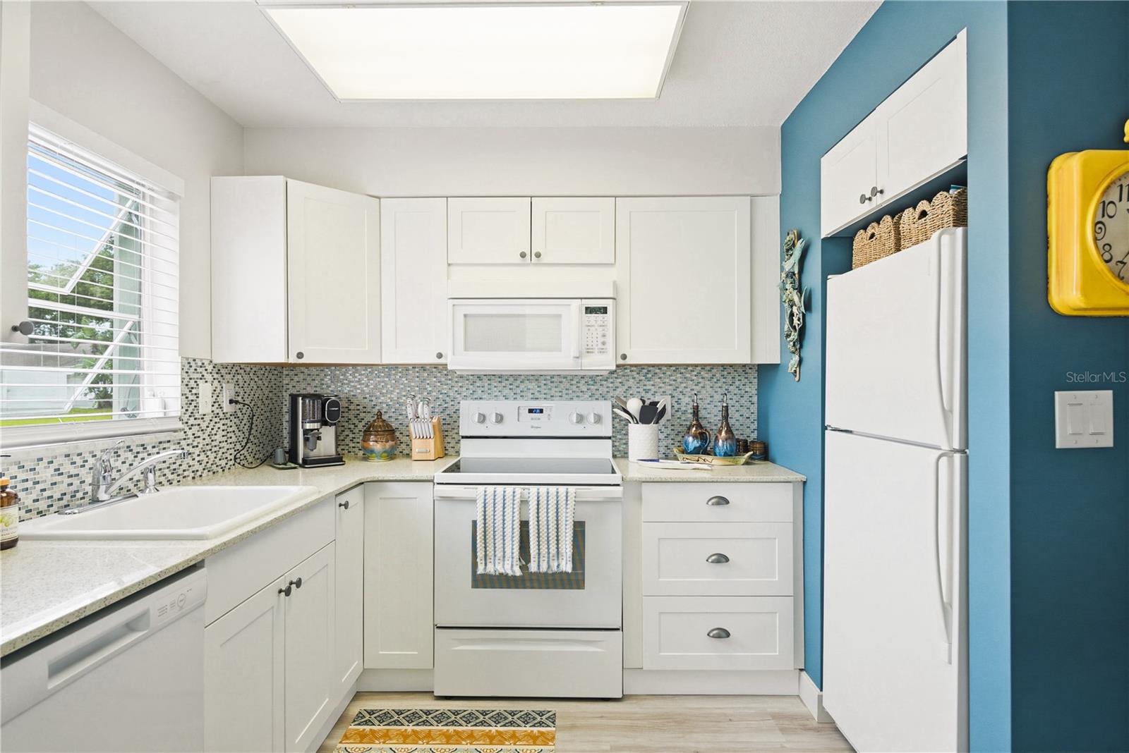 Nicely equipped kitchen. Enjoy natural light with two windows in the kitchen.
