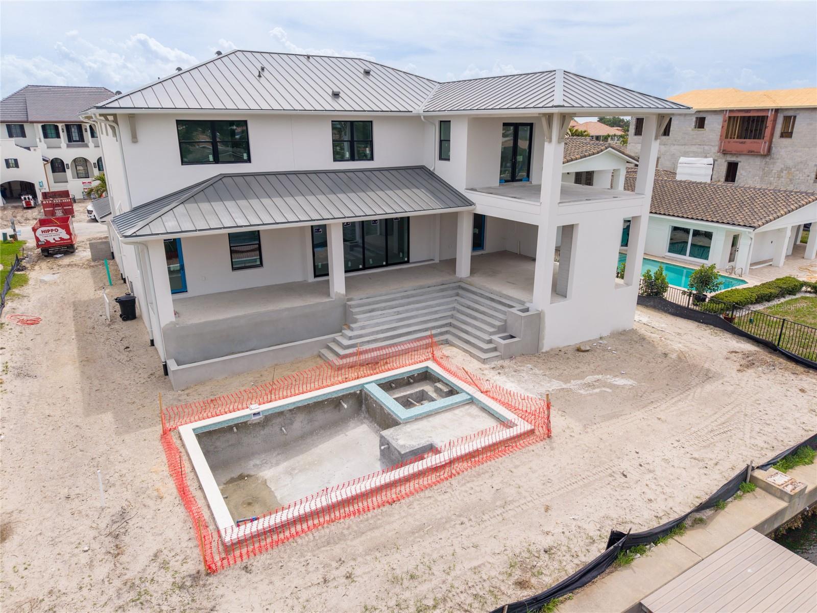 Huge lot with green space and a large pool