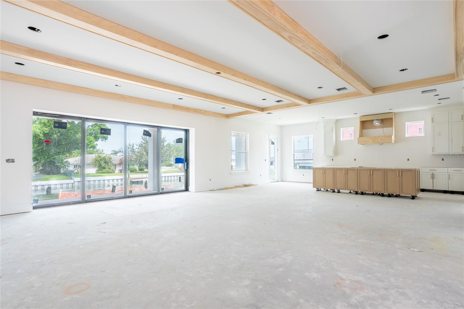 Custom Kitchen open Living space overlooking water and pool