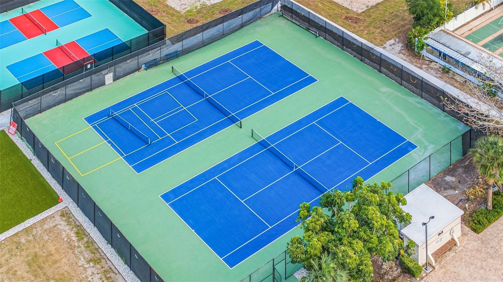 Multiple tennis courts and recreation areas