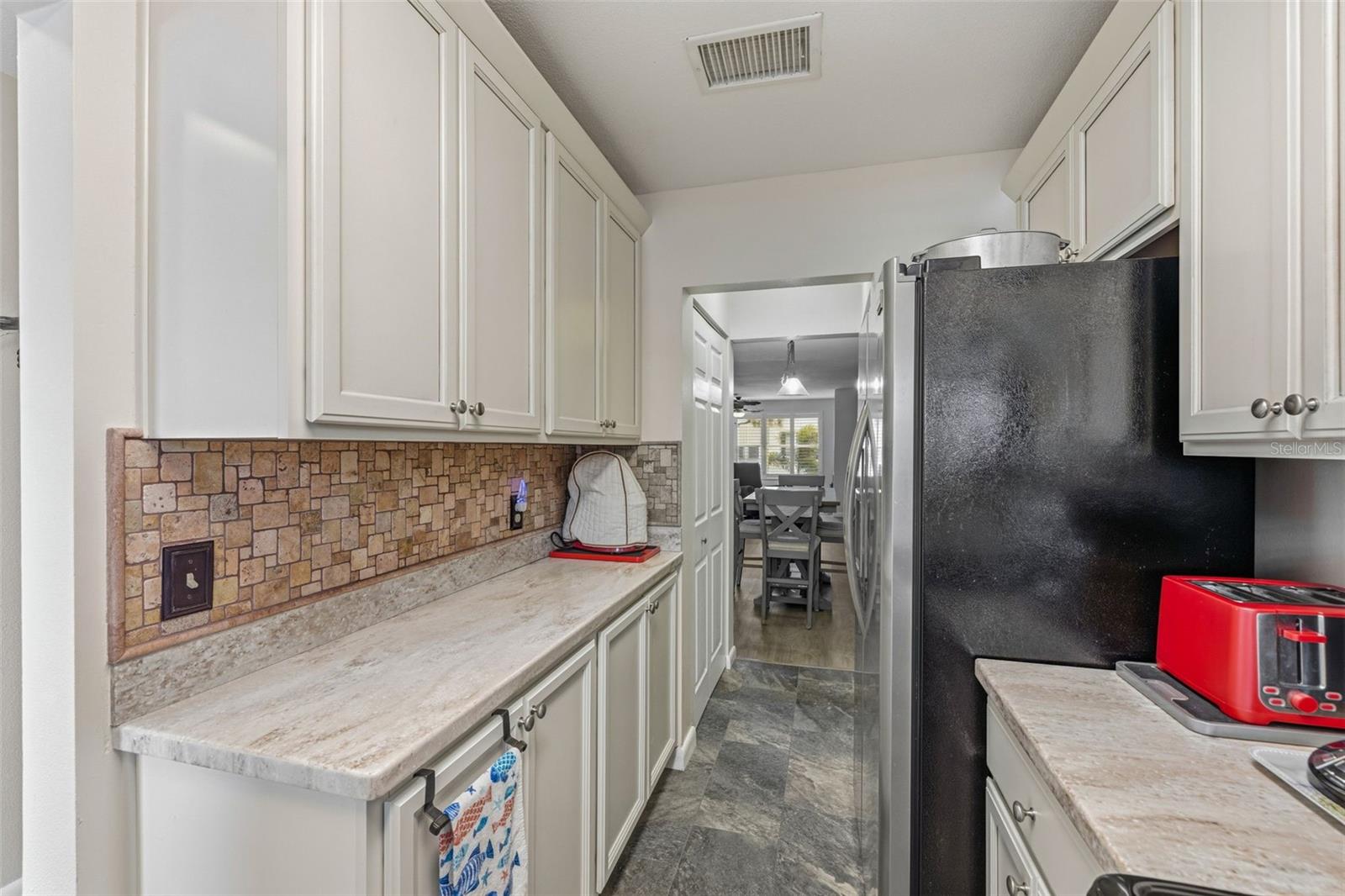 Kitchen with extended counter space and cabinetry