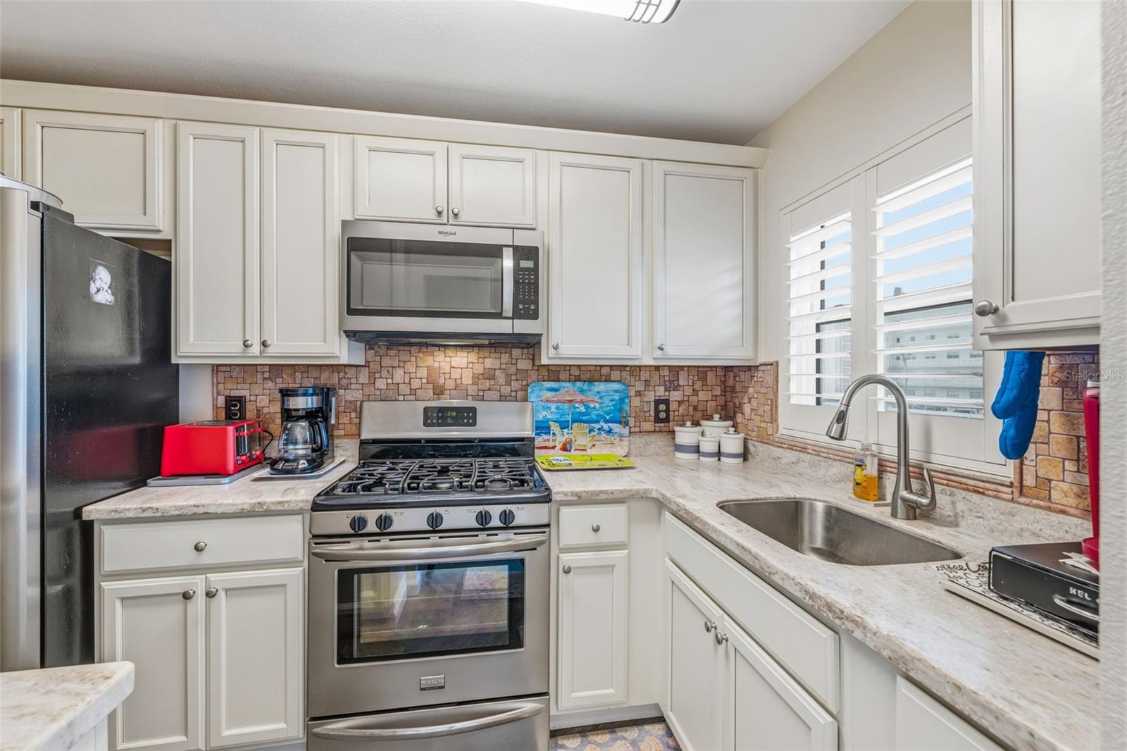 Updated kitchen with white cabinetry
