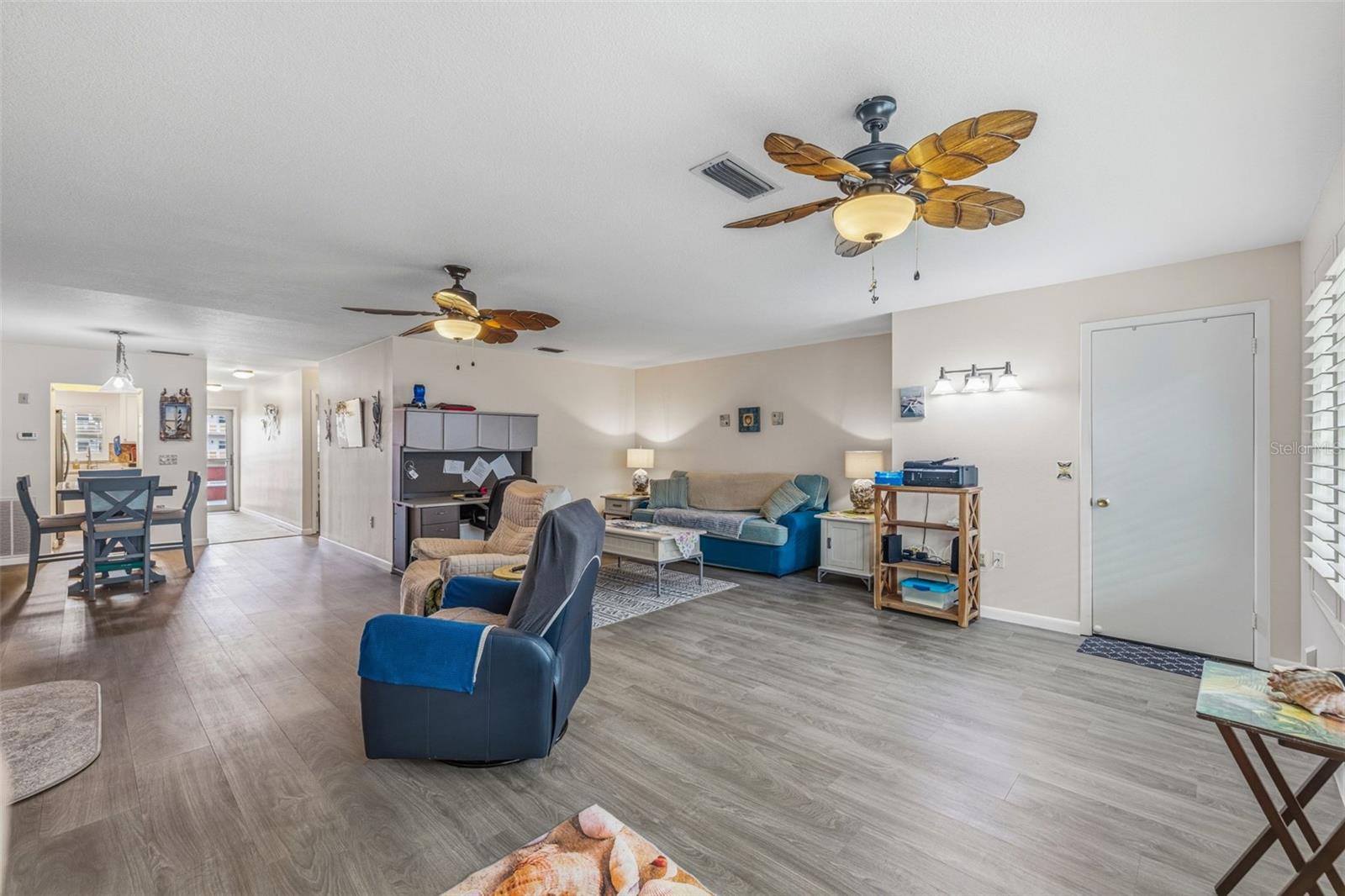 Living room with updated flooring and neutral tones