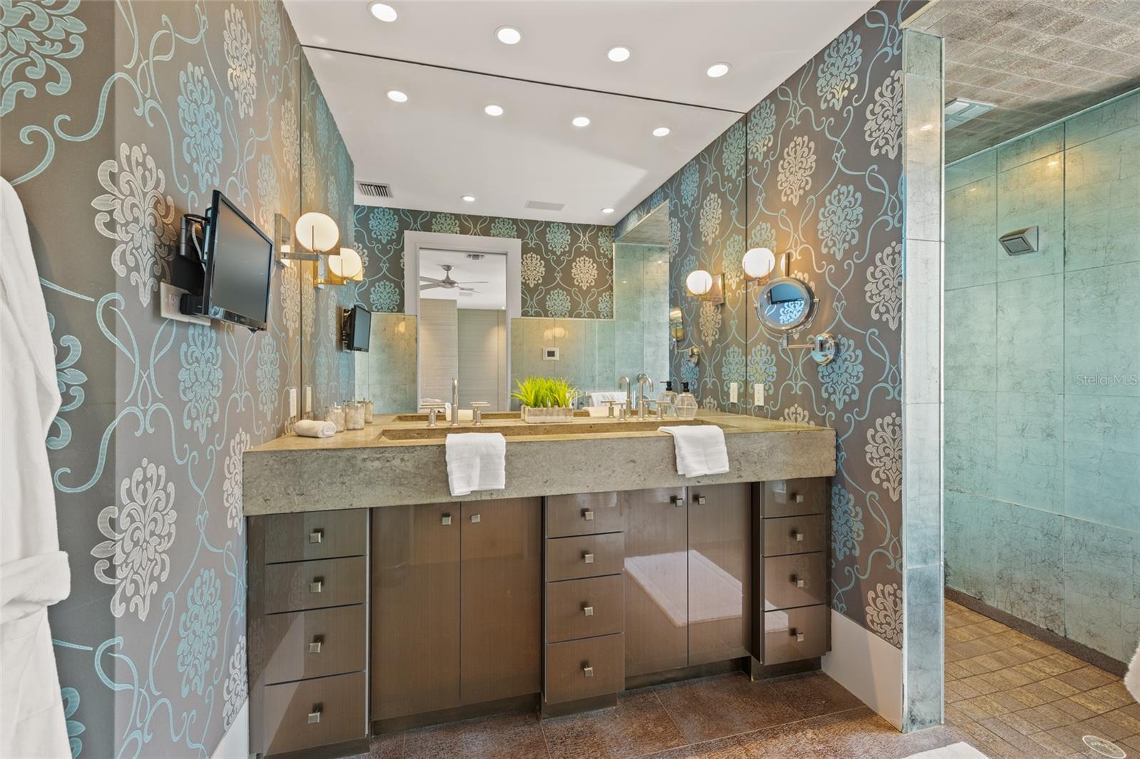 Luxurious primary bath with custom vanity and spa-inspired designer details-Including towel warmers