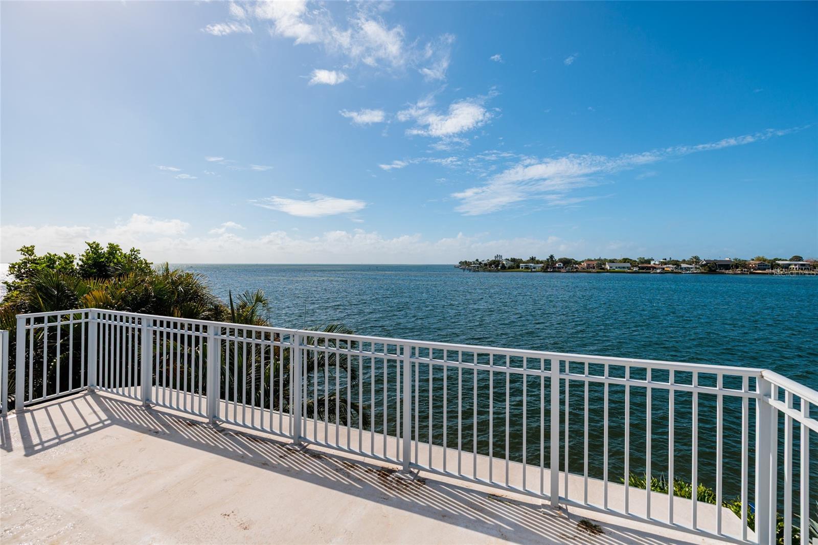 Expansive rooftop observation deck with panoramic water vistas