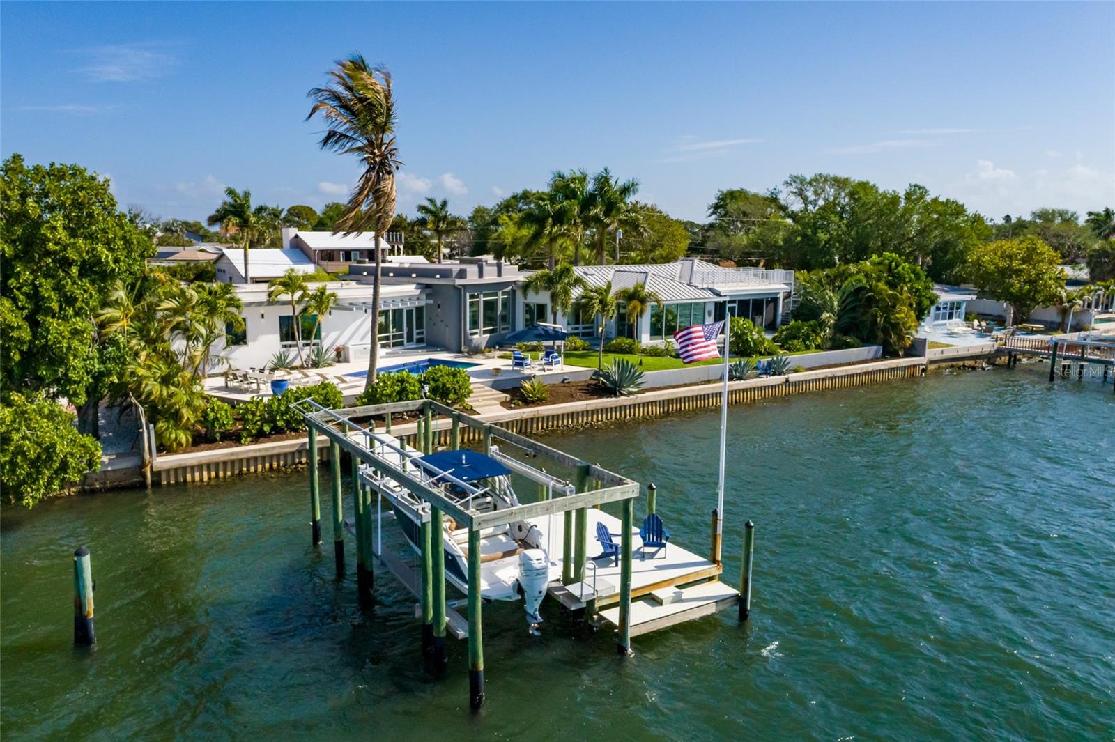 Aerial view showcasing prime waterfront frontage and private boat lift