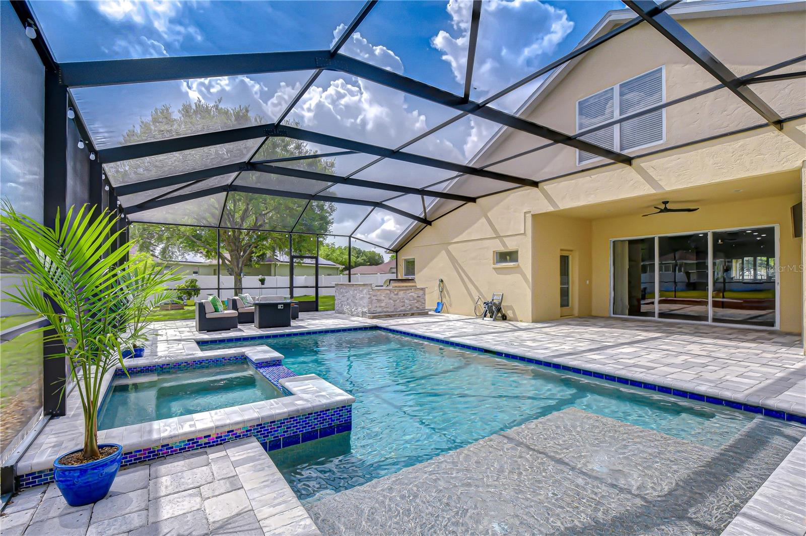 Heated saltwater pool and spa with Pebble Tech finish.
