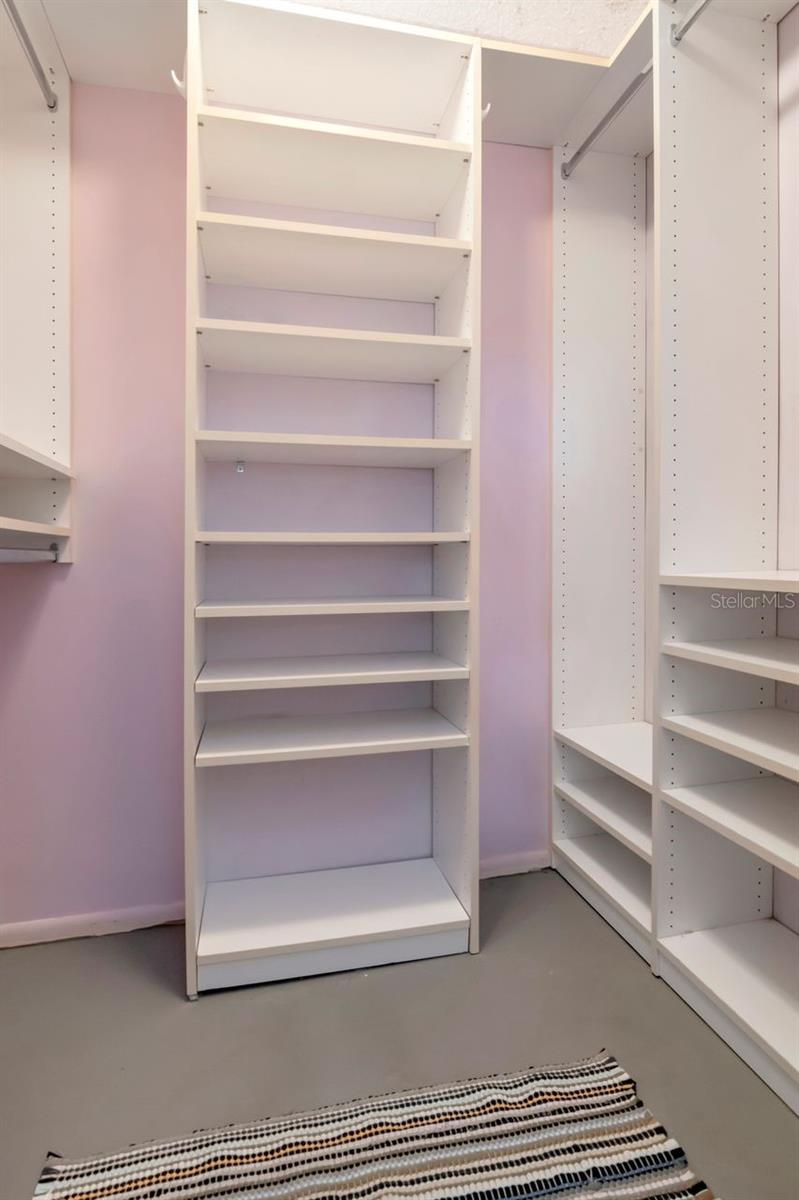 Guest bedroom walk in closet - so much storage!