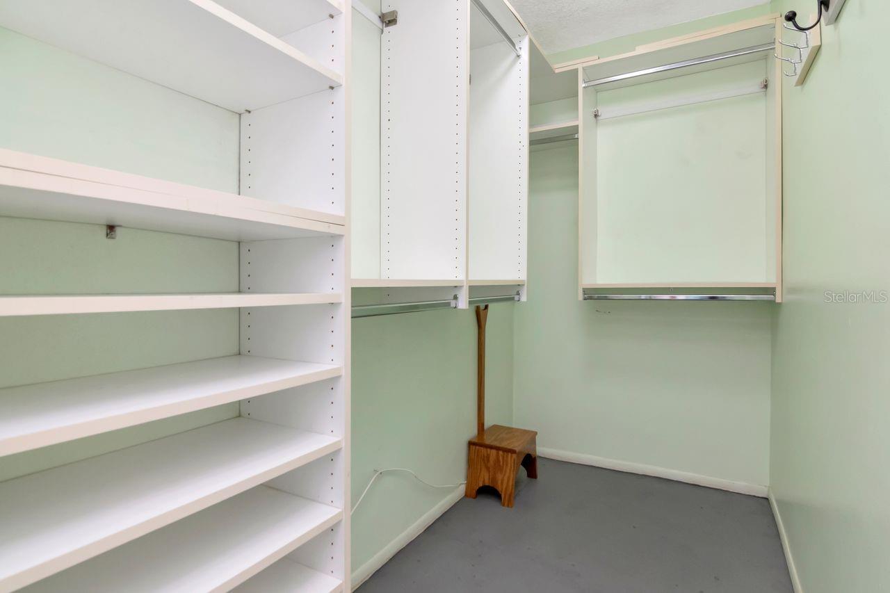 Walk in closet in primary bedroom