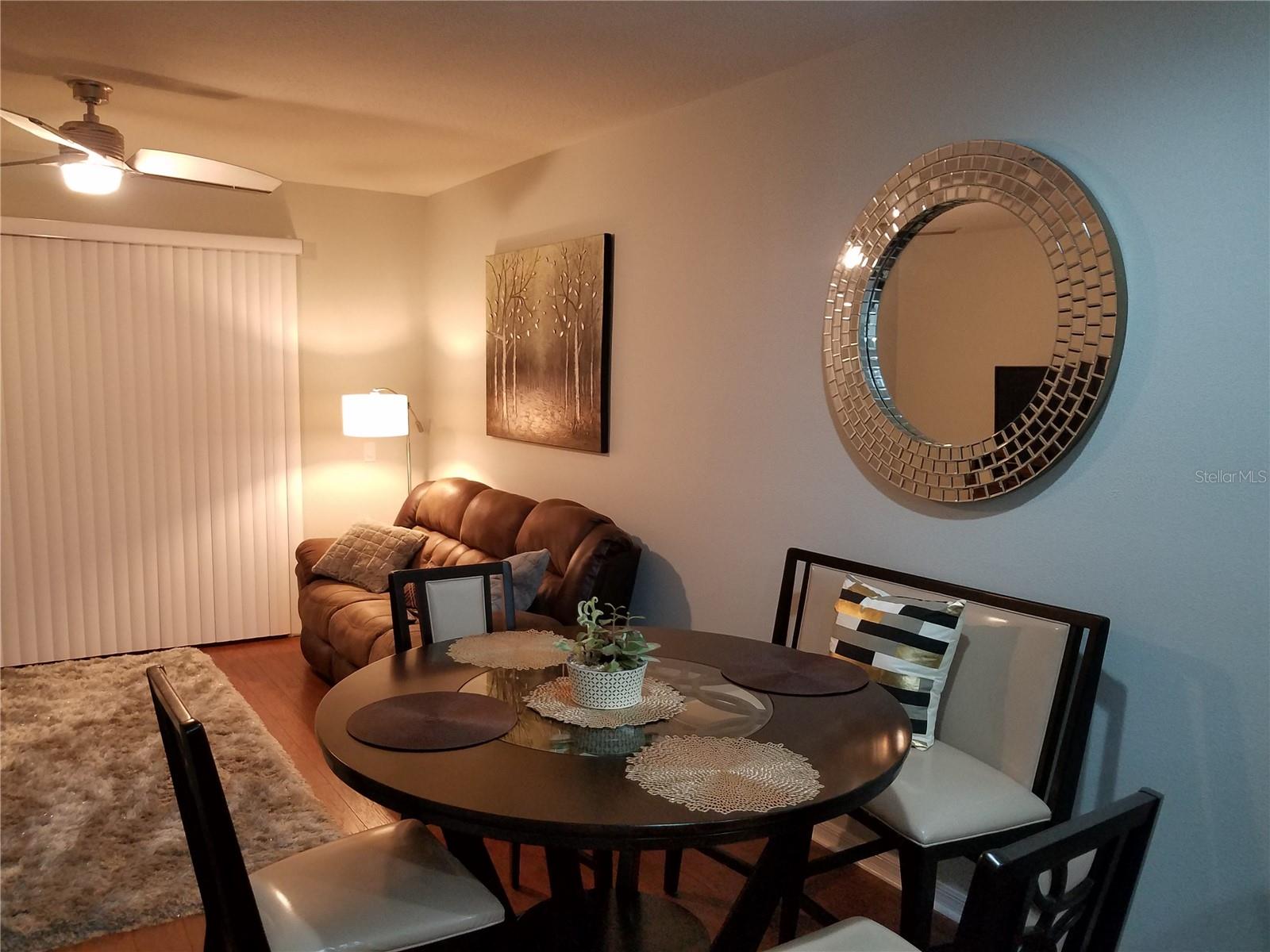 Cozy, open dining and living area designed for connection and comfort—ideal for hosting, unwinding, and enjoying the home’s warm, welcoming atmosphere.