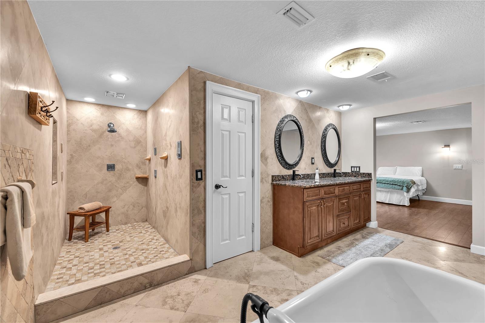 The shower in the primary ensuite is a masterpiece complete with multiple shower jets that are programmable.