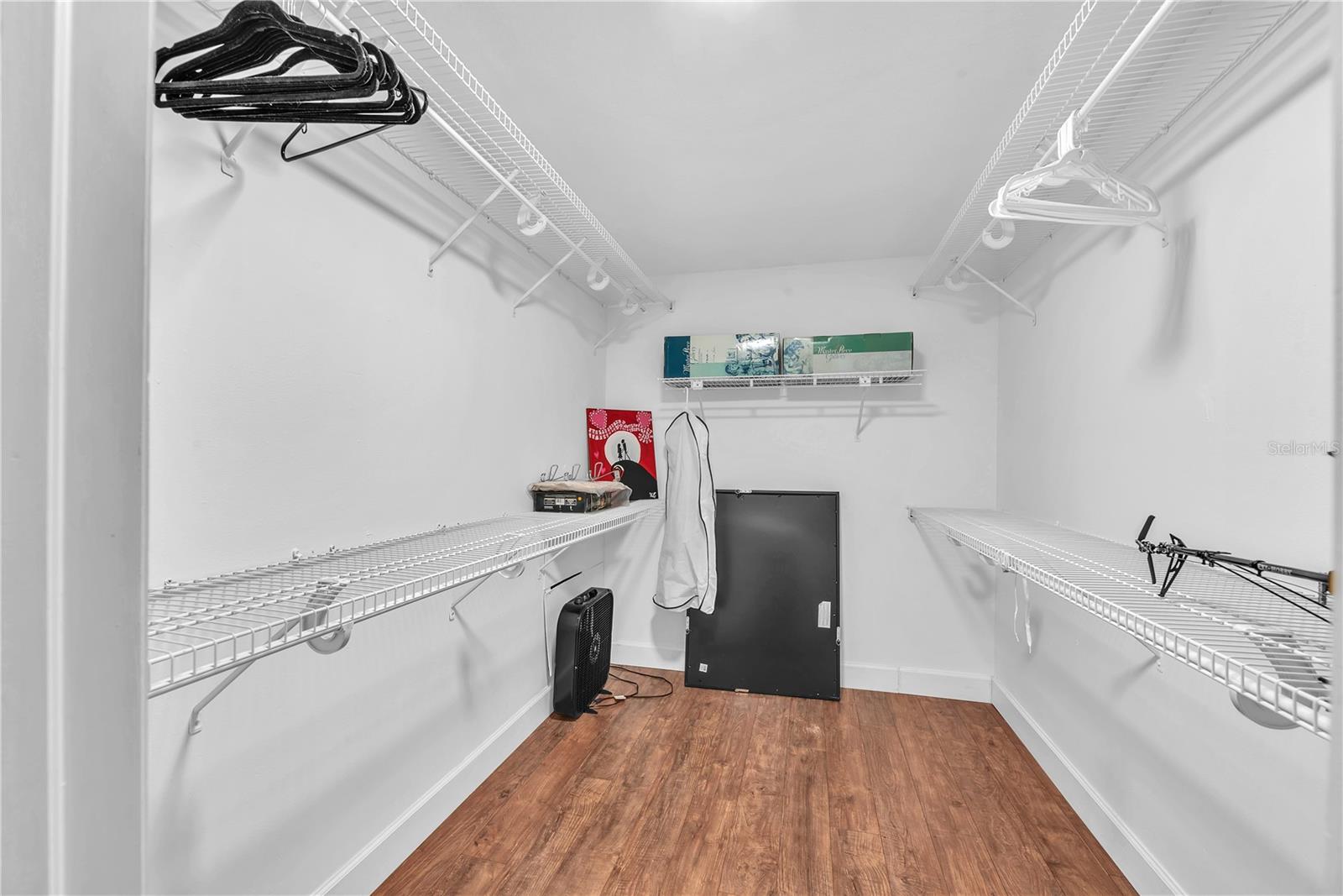 Walk-in closet in secondary bedroom upstairs.