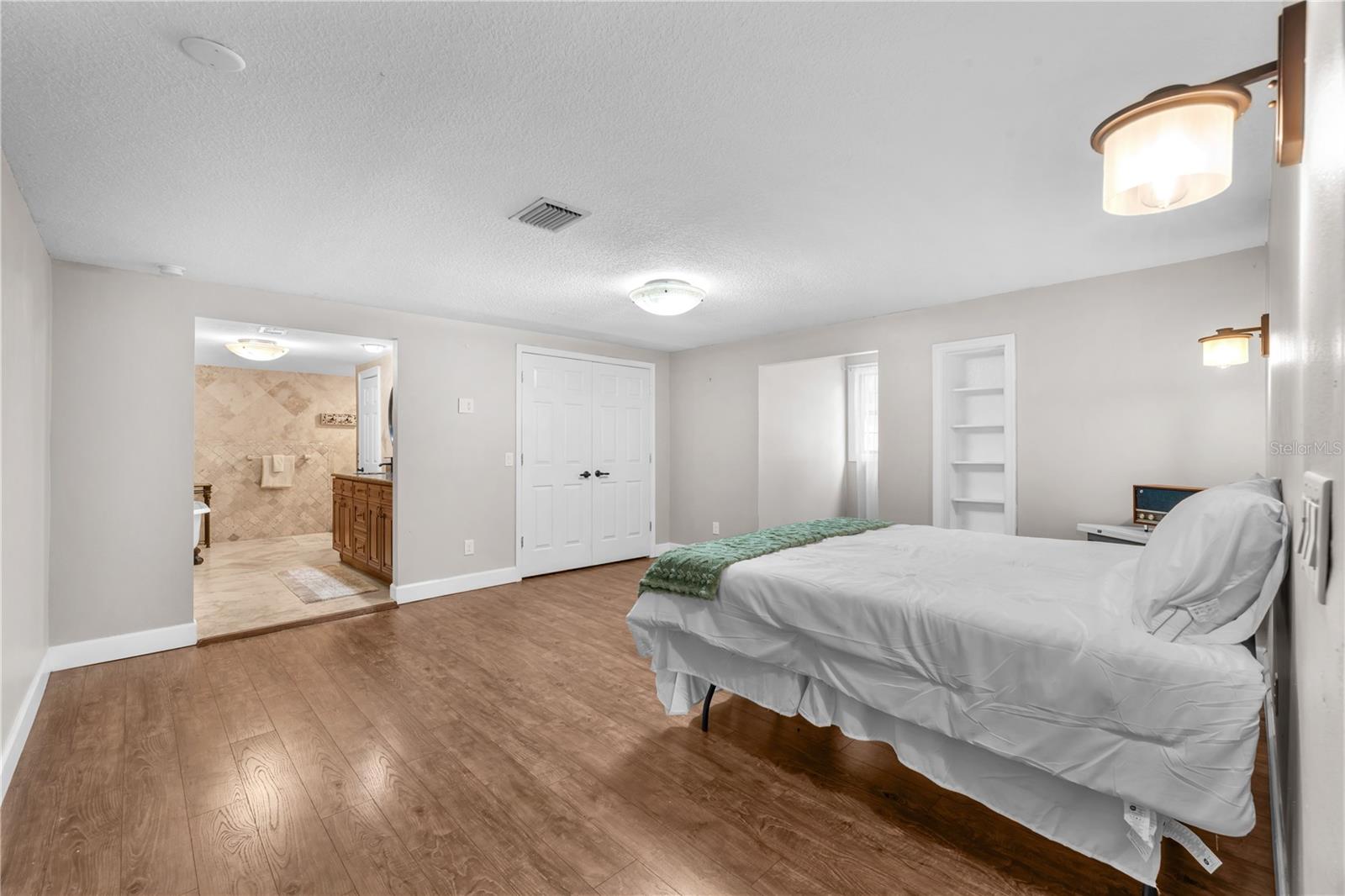 The primary suite provides a luxurious escape with a large walk-in closet and ensuite connected.