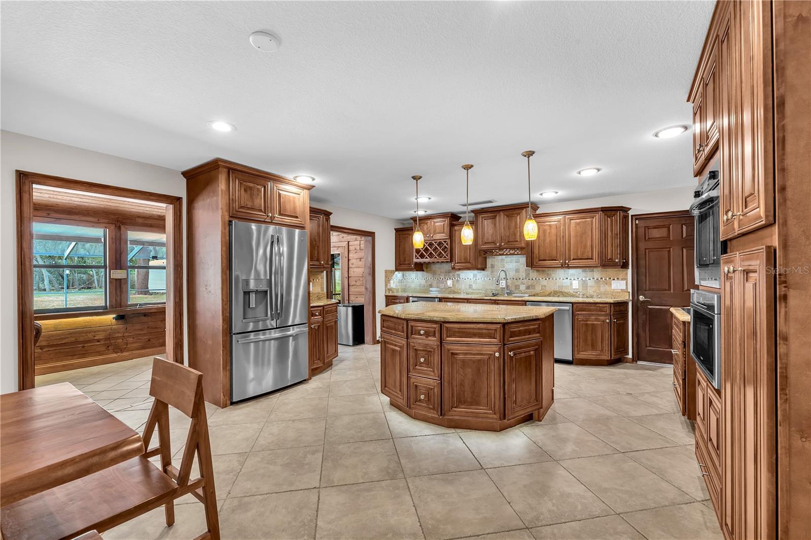 Stunning custom-built island anchors the space.