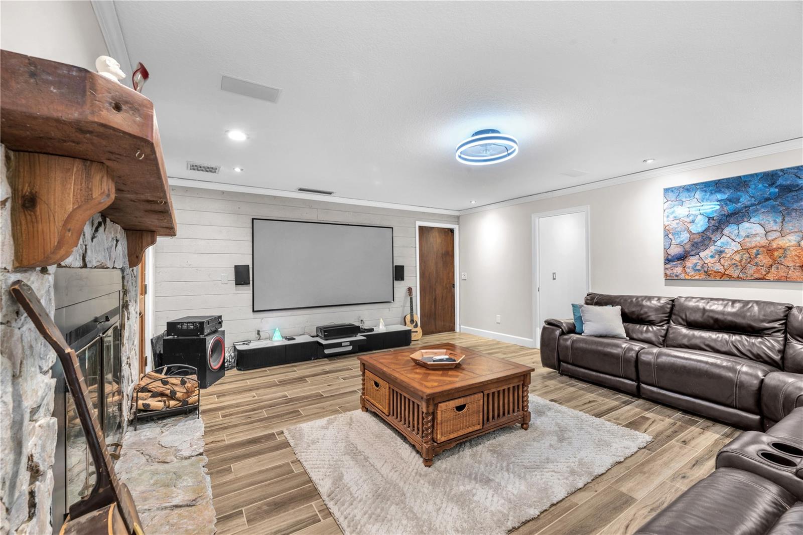 A separate family room/ TV room creates the perfect setting for cozy nights in streaming your favorite series complete with surround sound for an immersive experience (TV does not convey)