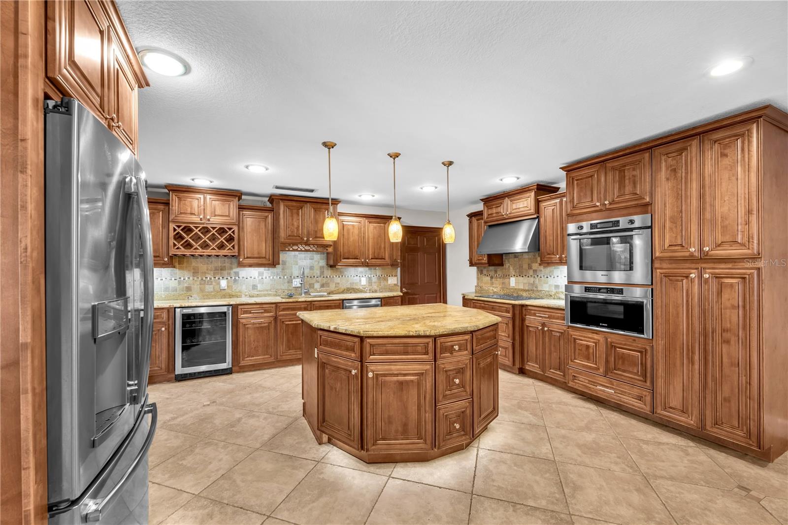 The updated kitchen is both functional and eye-catching with porceline tile and granite counters.