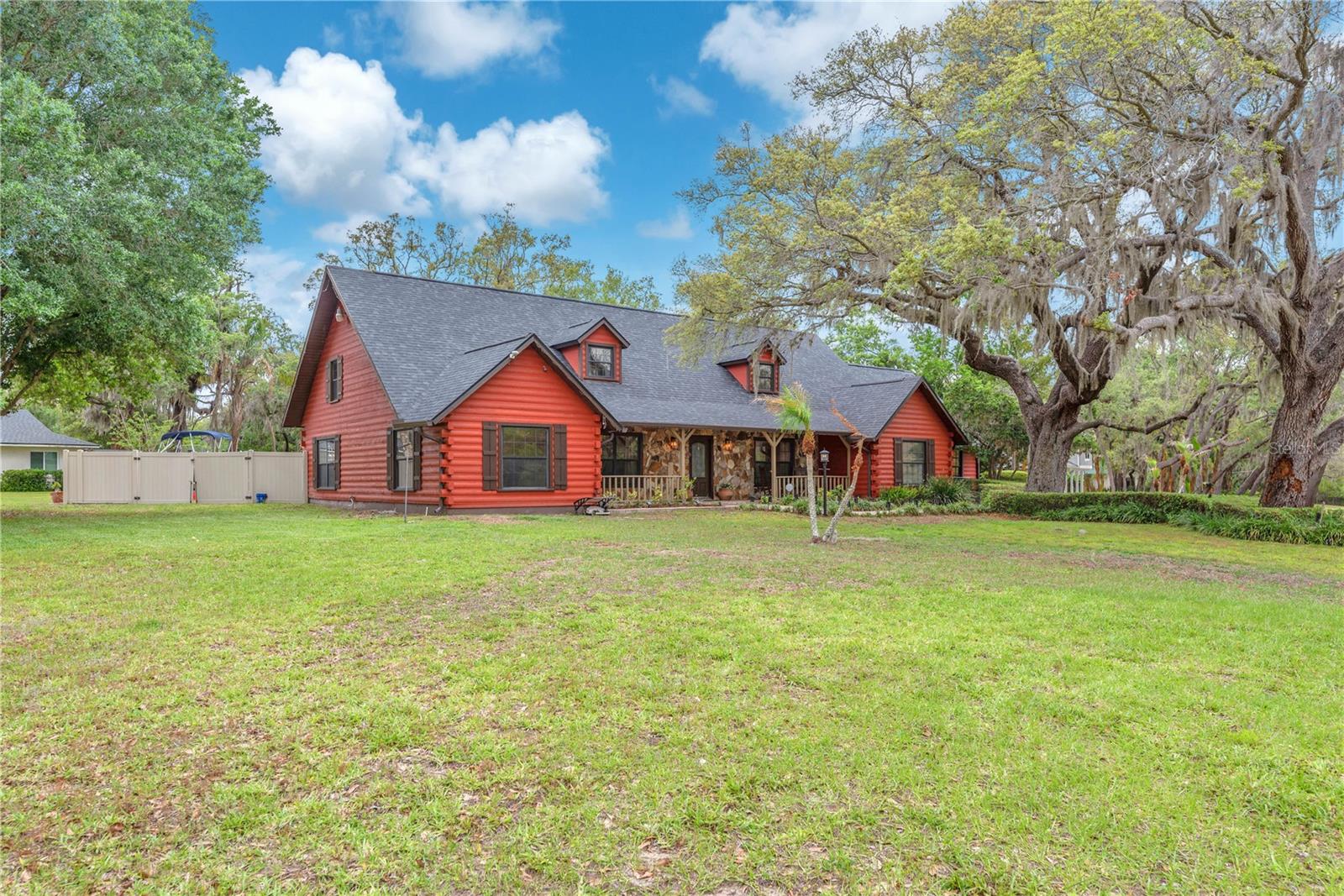 Enjoy peaceful mornings and relaxing evenings on the inviting front porch, where lake views and nature set the tone for everyday living.