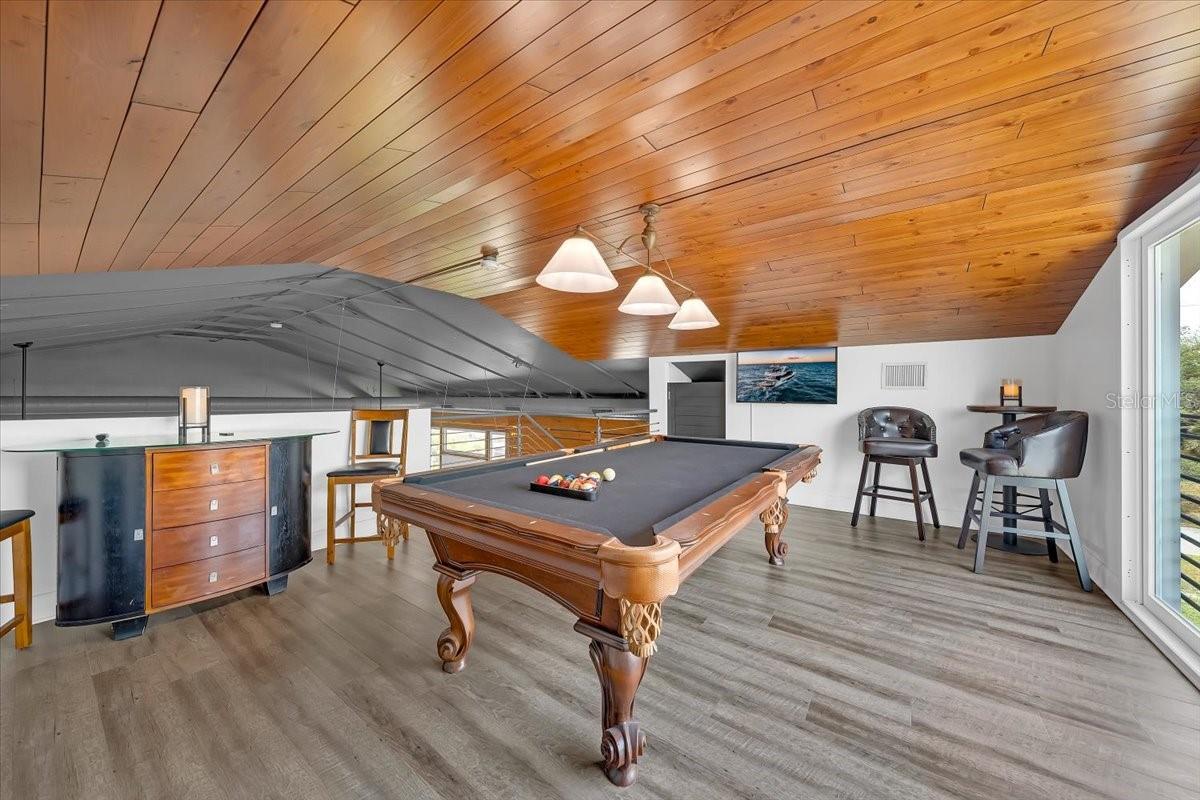 Second loft ideal for billiards, office, or media room.