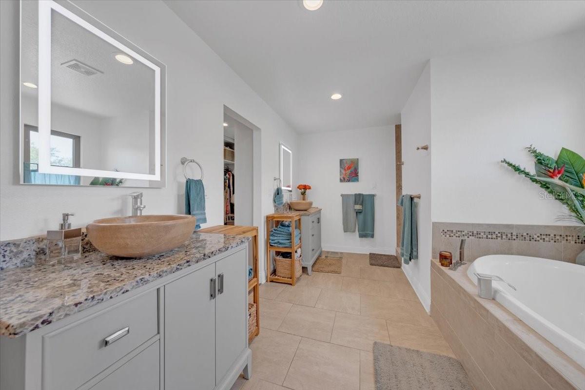 Spa-like bath with designer tile finishes.