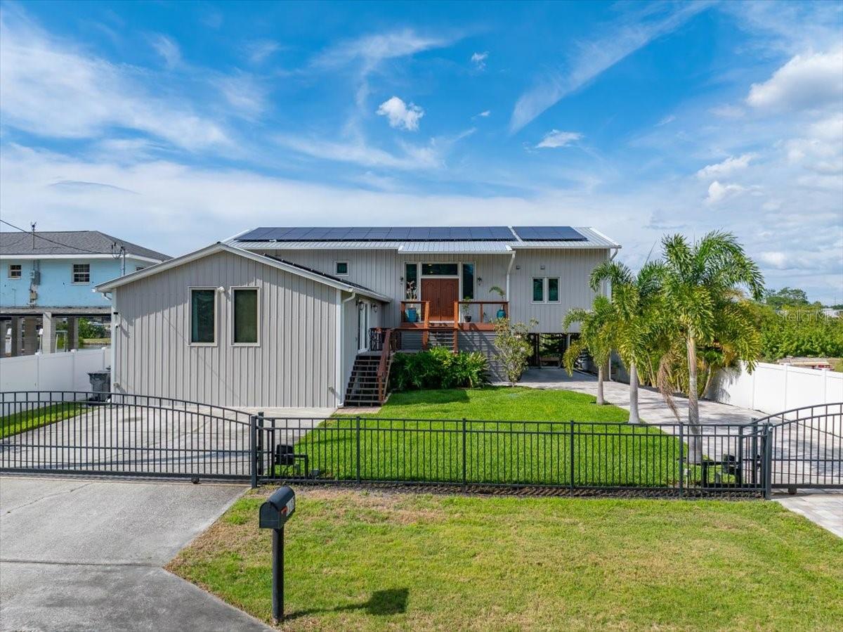 Unique curb appeal with modern and natural elements.