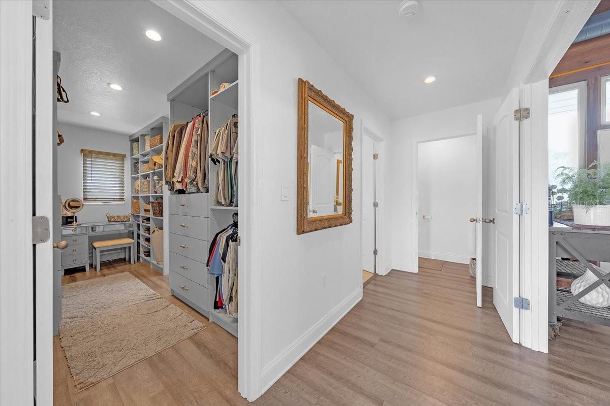 Massive walk-in closet with ample storage.