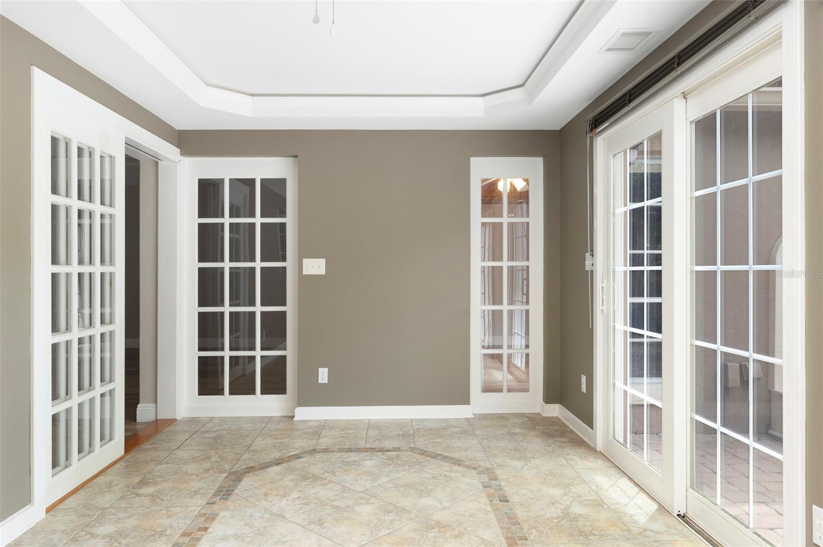 Bonus room with sliders going to courtyard