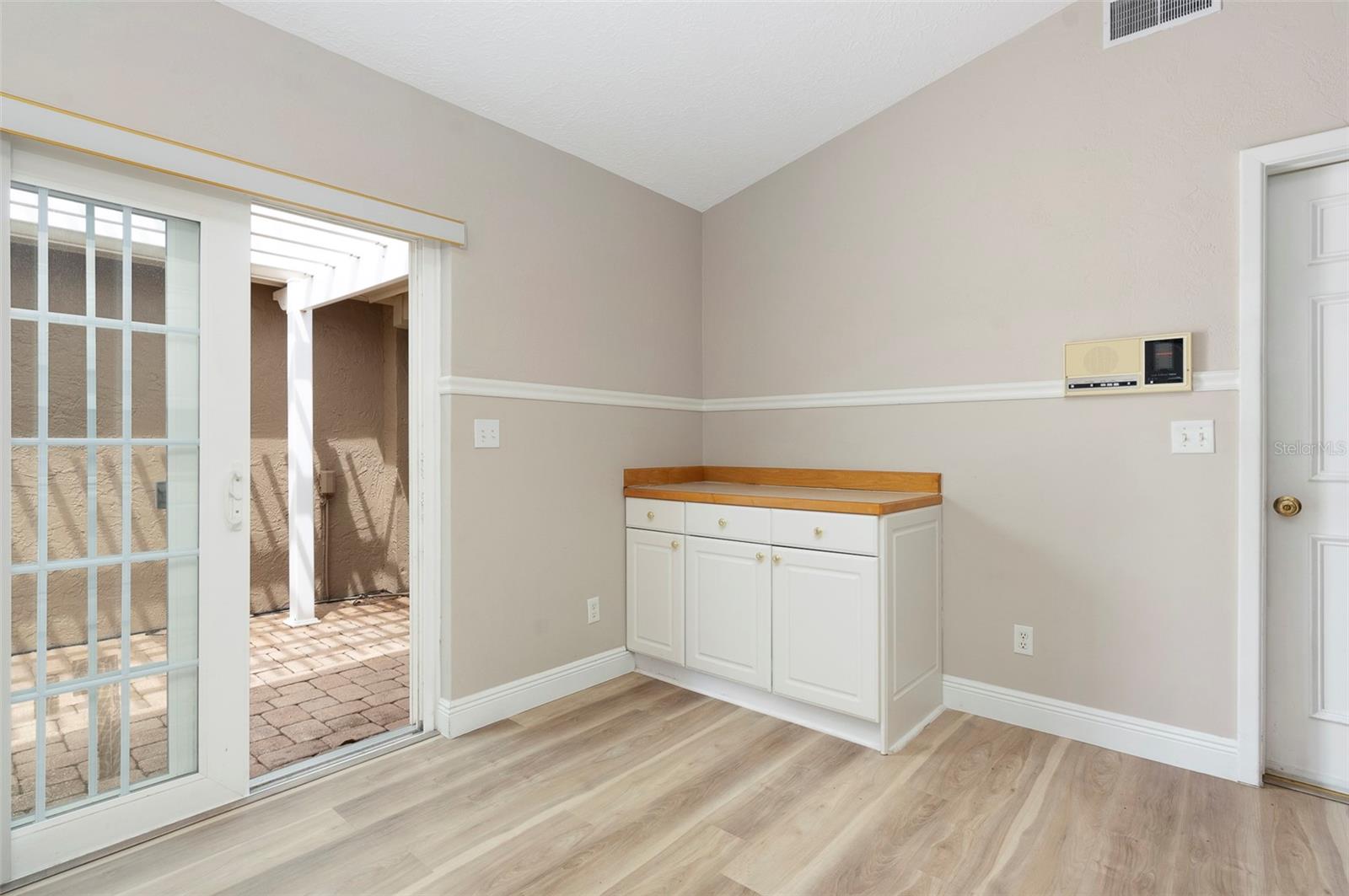 Kitchen with sliders to side courtyard