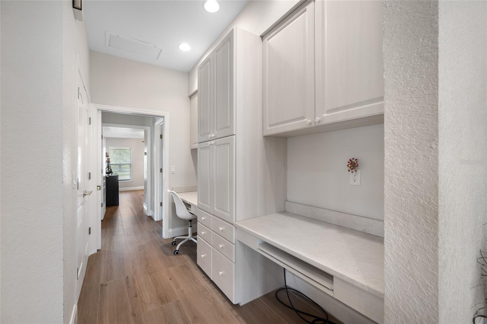 Hallway with desk and storage- leads to 3 ensuite bedrooms