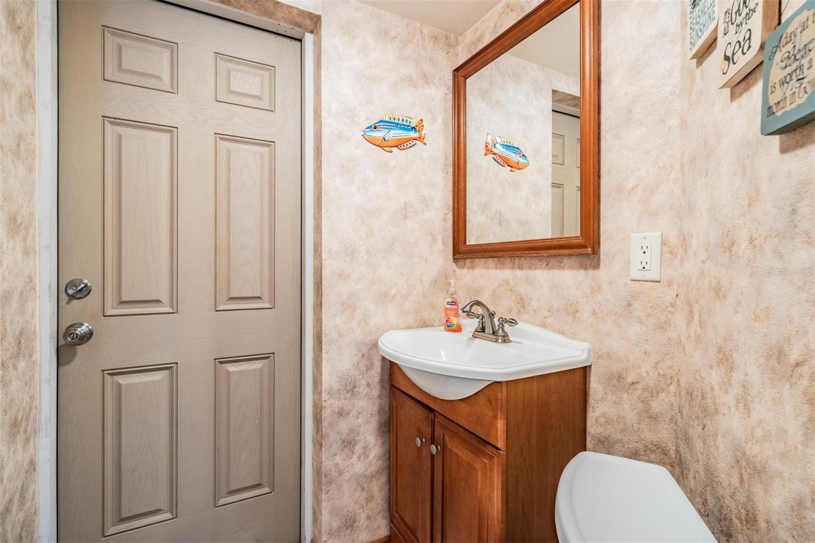 Half bath off of Family room w/pool access