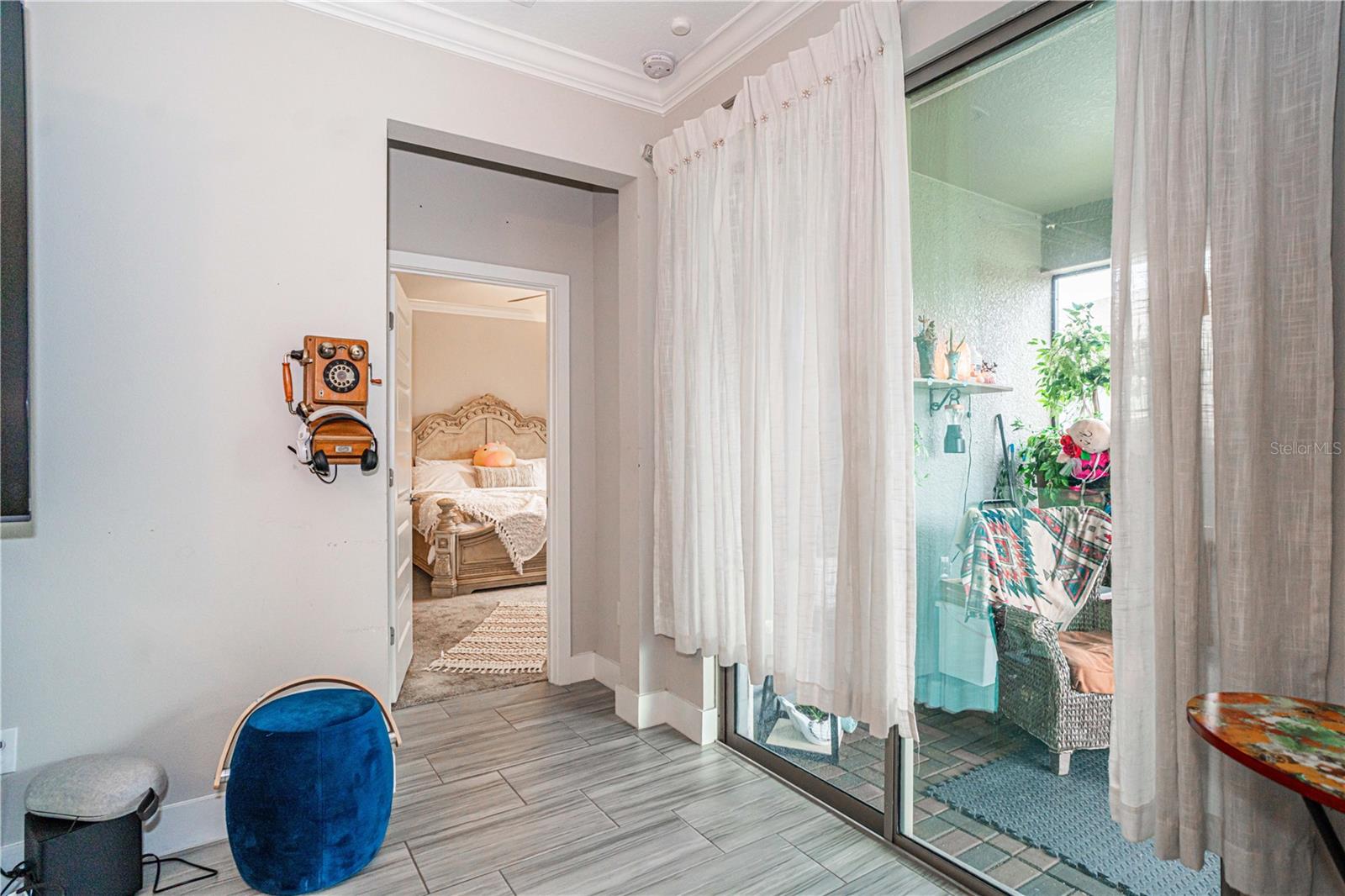 view of primary bedroom and lanai from livingroom