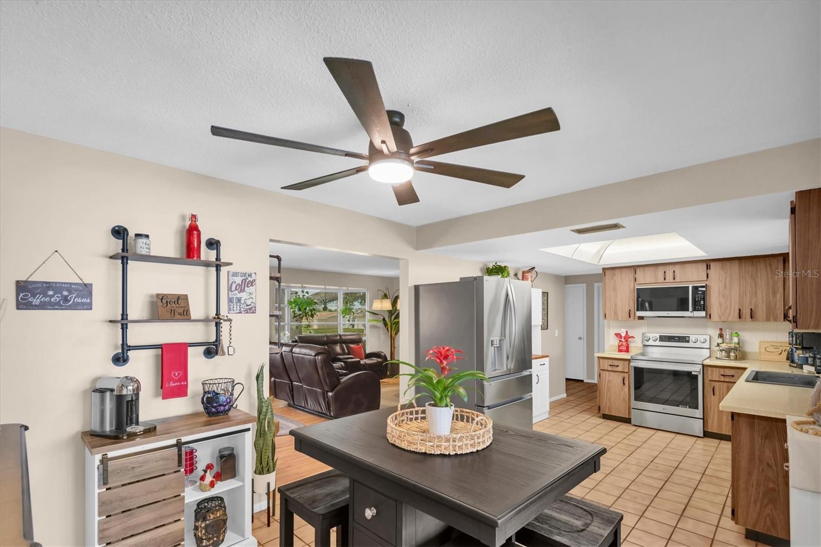 Dining area with newer ceiling fan!