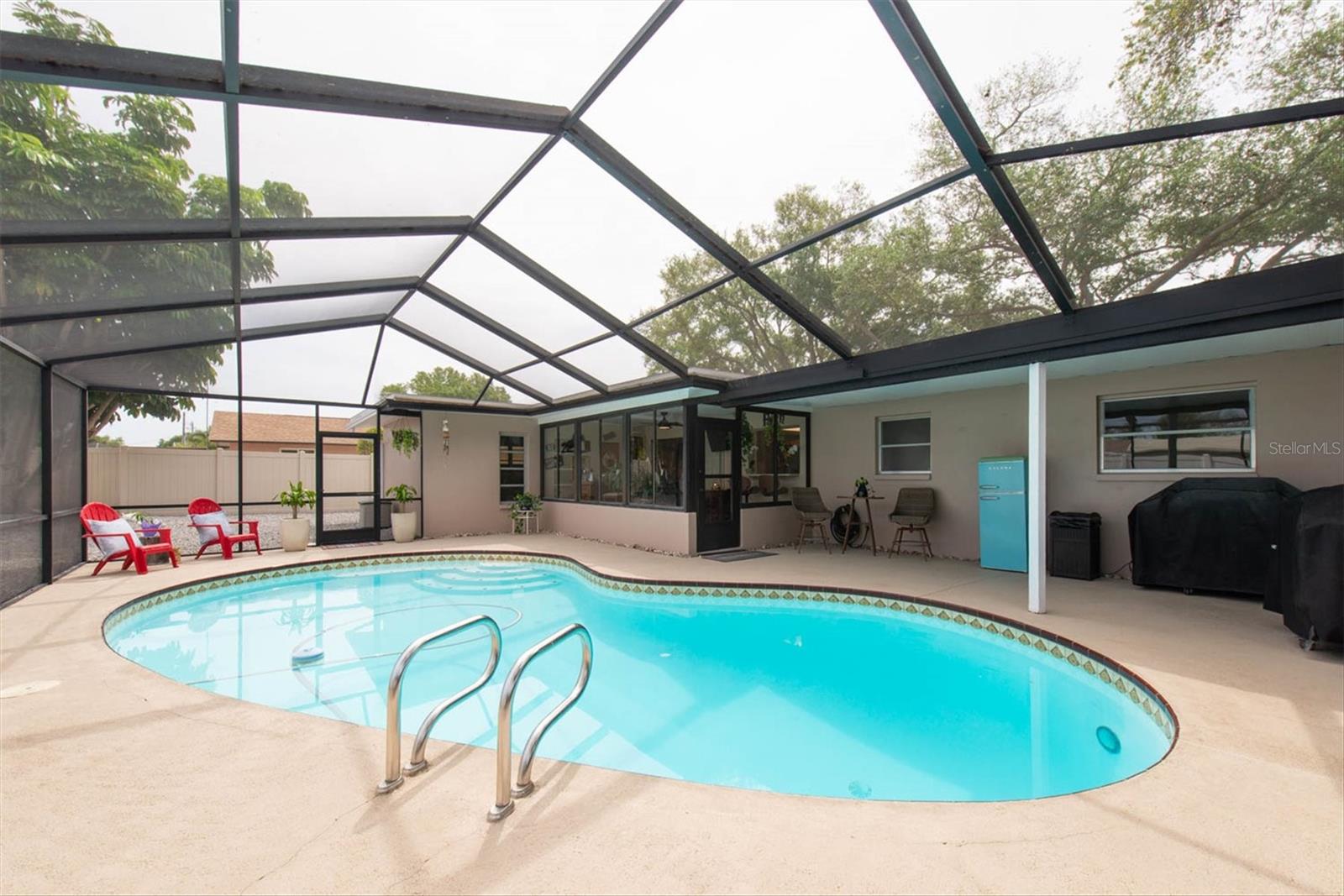 Plenty of room under the covered area to hang out by the pool!