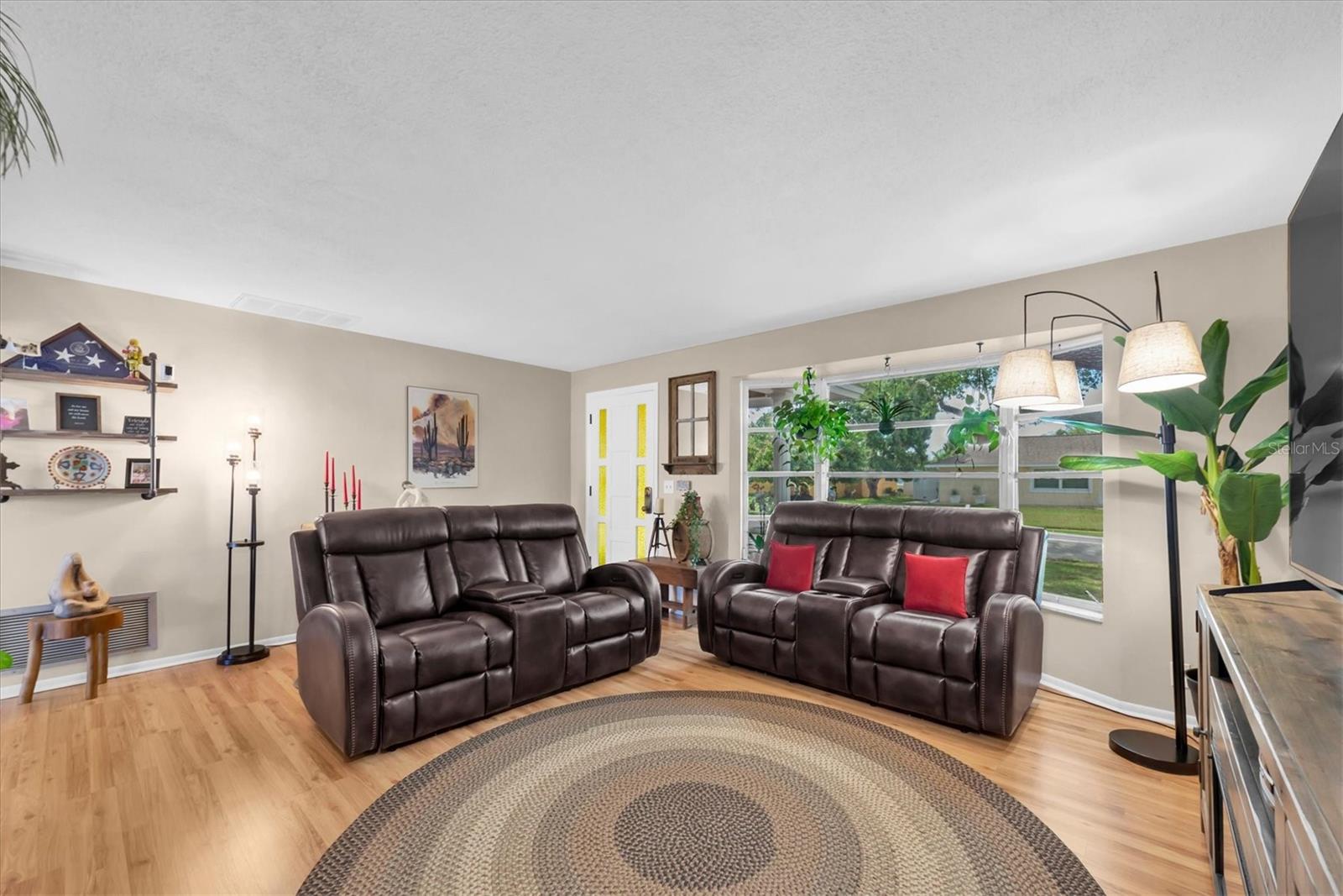 Front living room with nice natural light with the larger window.