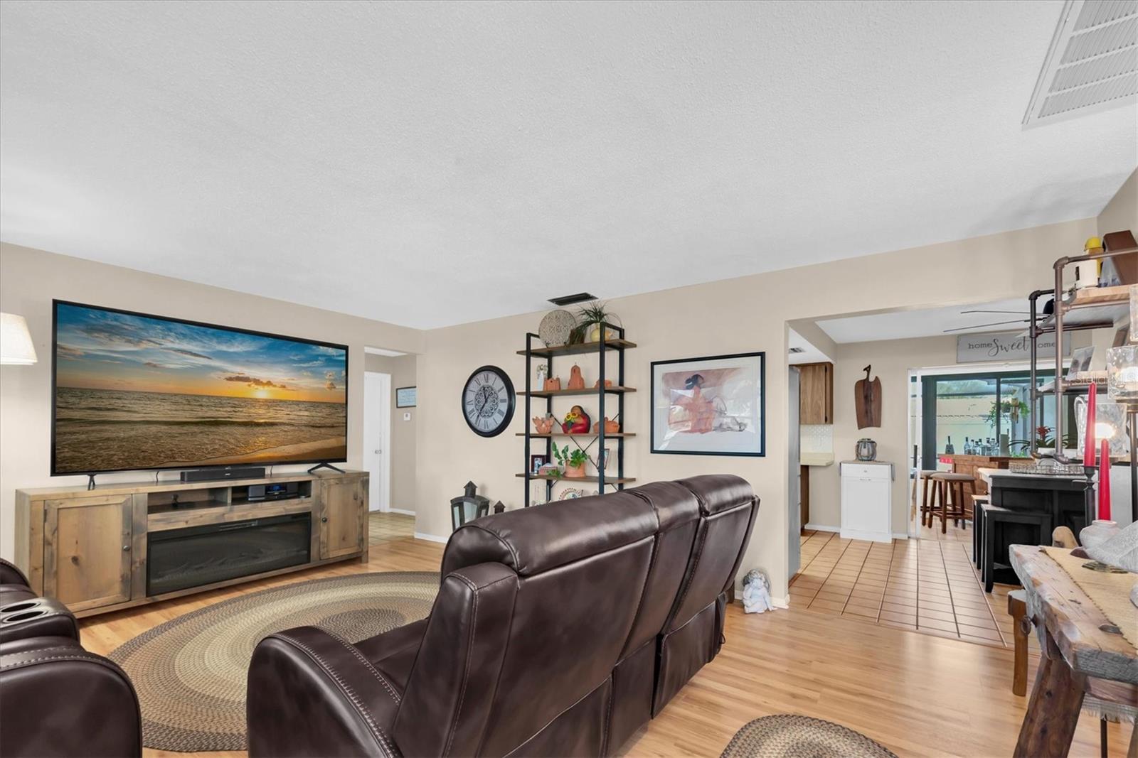 Front living room flows into the dining area and two guest bedrooms off to the left with a main bathroom.