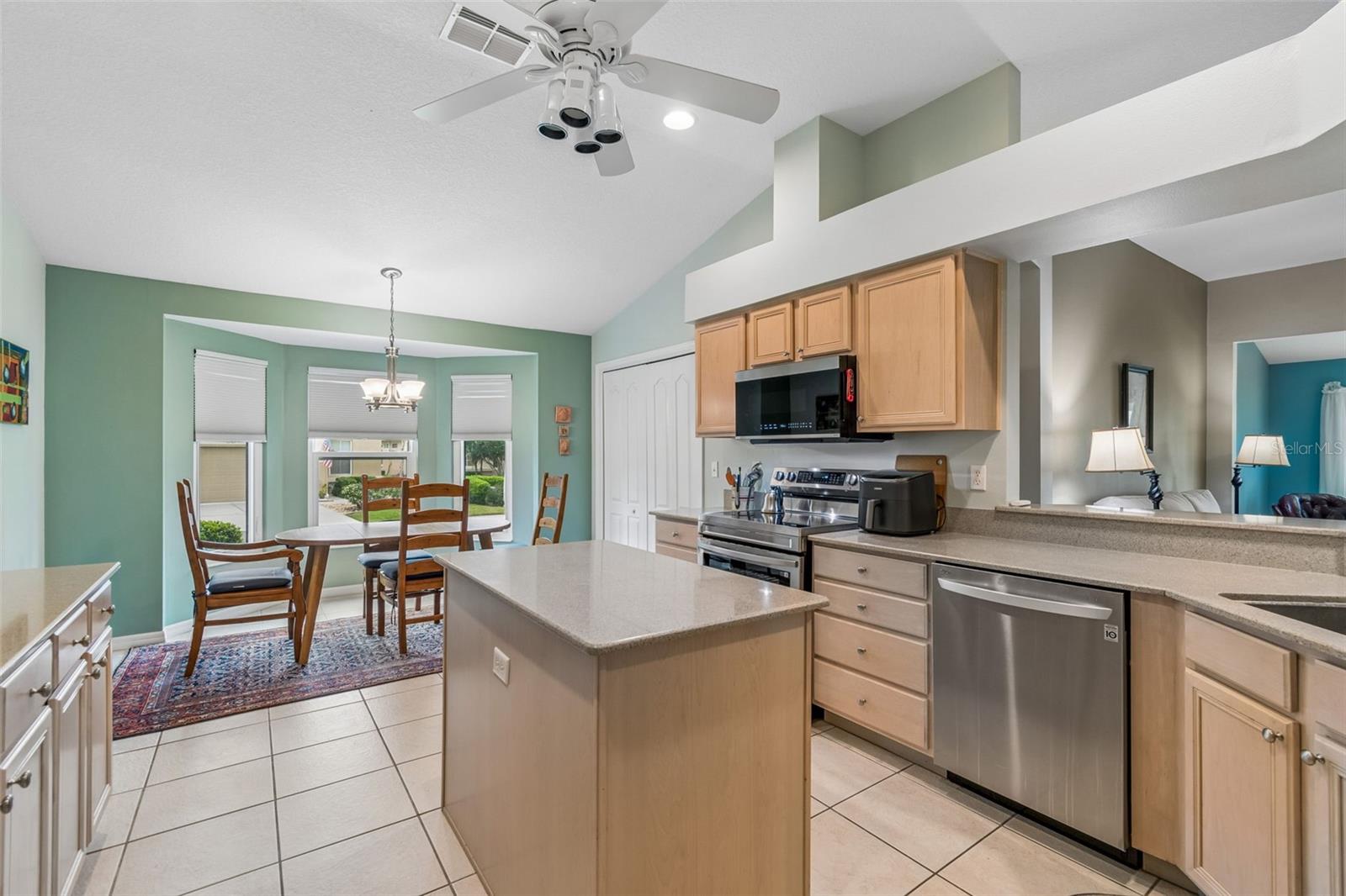 kitchen with maple cabinets and islandRich Corian & Maple!