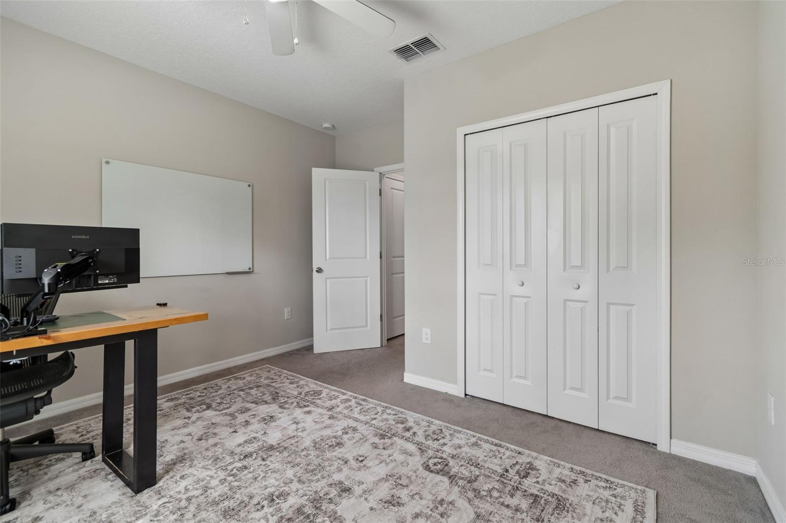 entrance right off the back of the kitchen next to a bathroom and closet