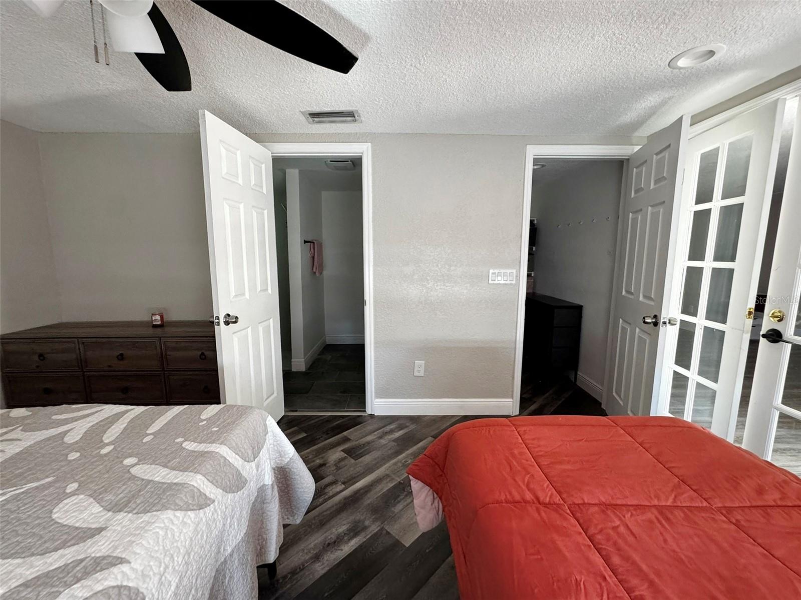 primary bedroom with en suite bath and walk-in closet