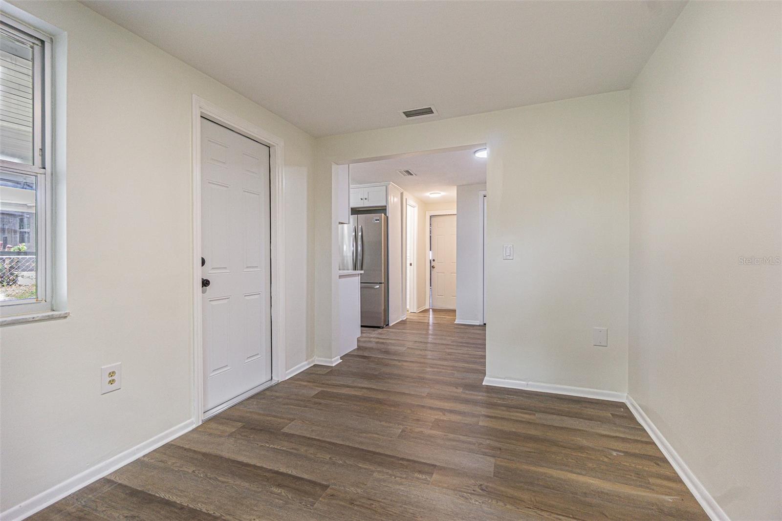 Den with view back to kitchen