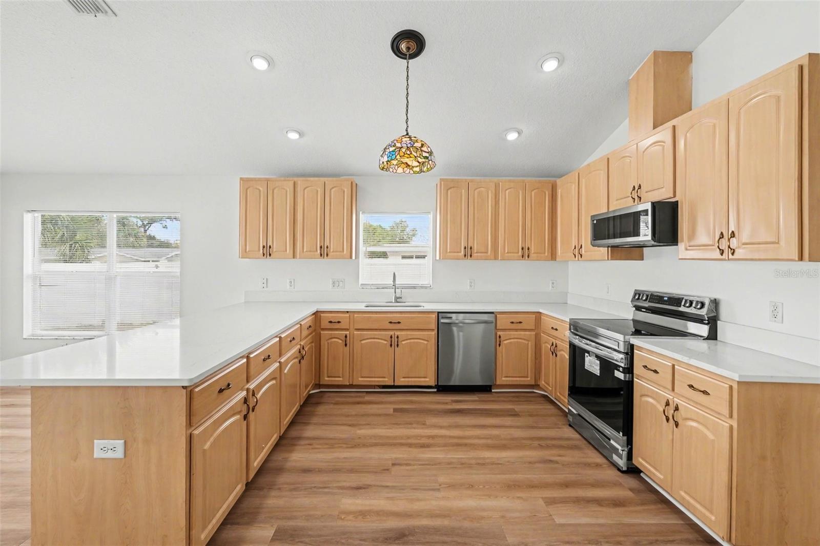 So much cabinet space and brand new quartz countertops!