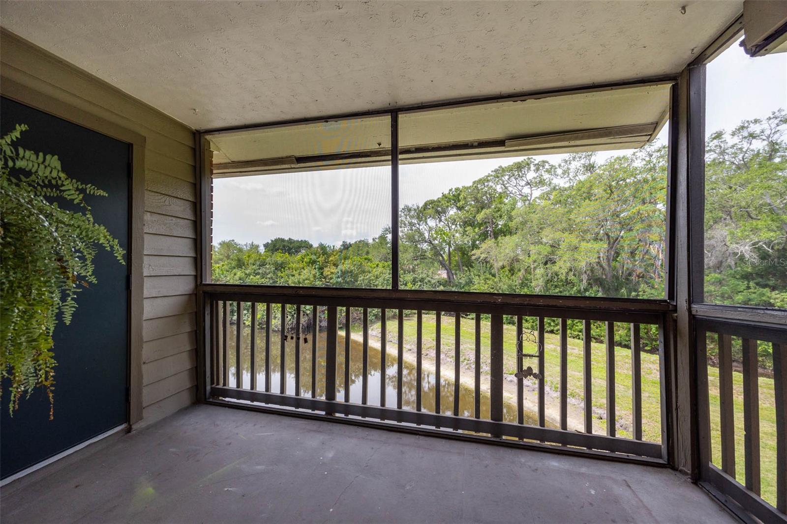 Screened porch overlooking pond and nature preserve