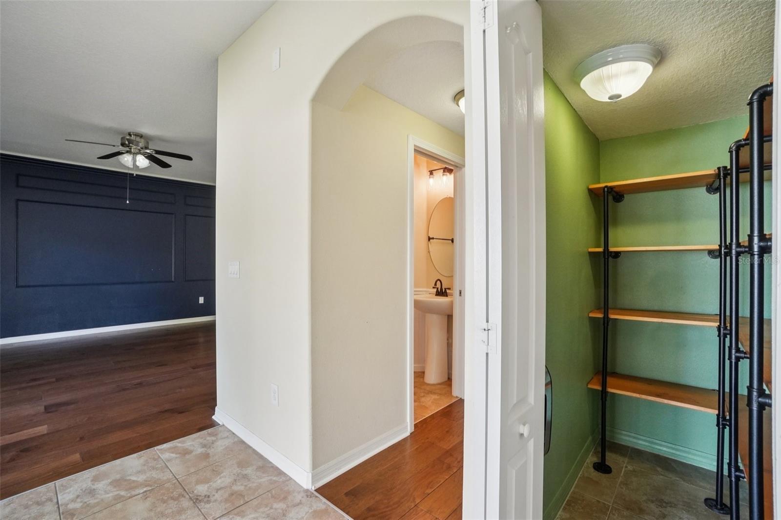 Kitchen PantryThe kitchen pantry features multi-level wood shelving with industrial-style black pipe brackets — a stylish and functional storage solution with plenty of room for pantry essentials.