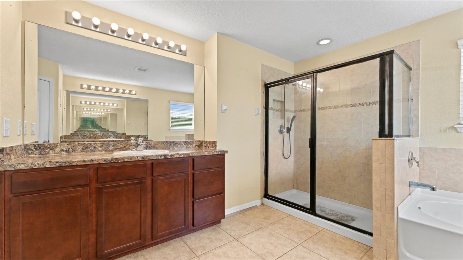 Primary Bathroom with 2 Separate vanities with storage