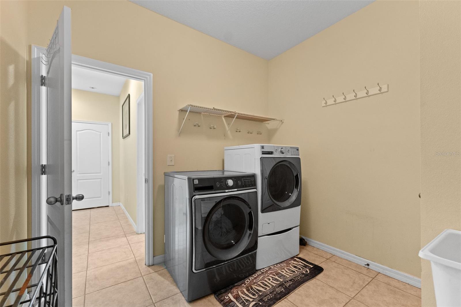 Laundry Room with entrance to 2-car garage