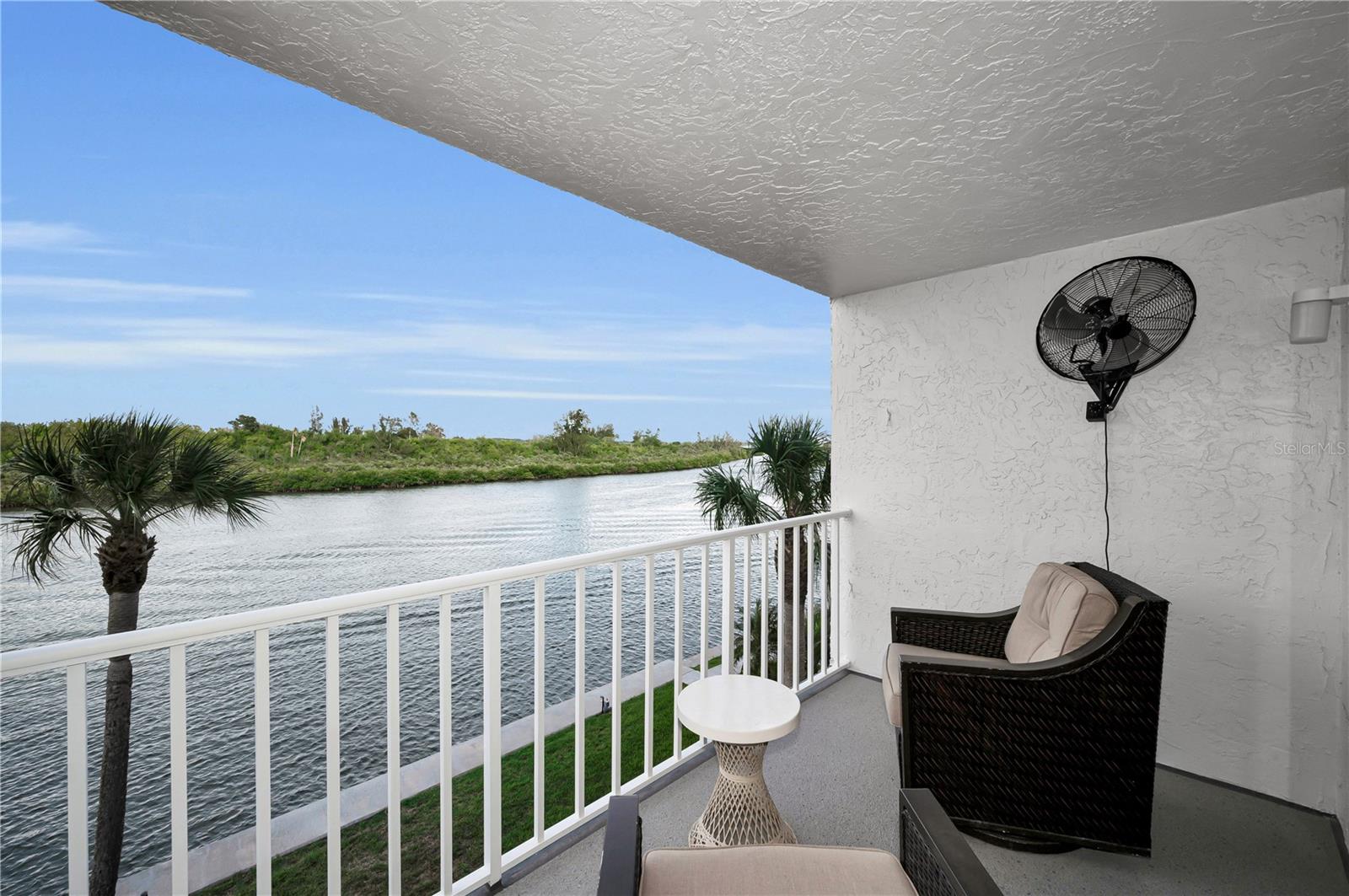 Savor peaceful waterfront moments from your private balcony sanctuary